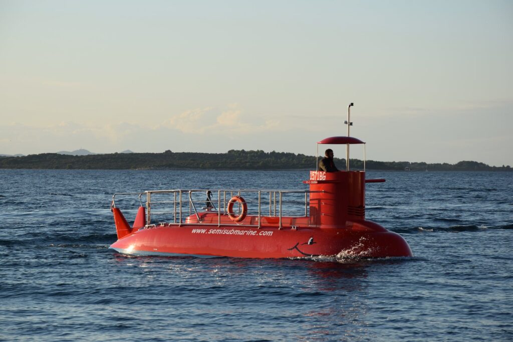 red submarine in body of water