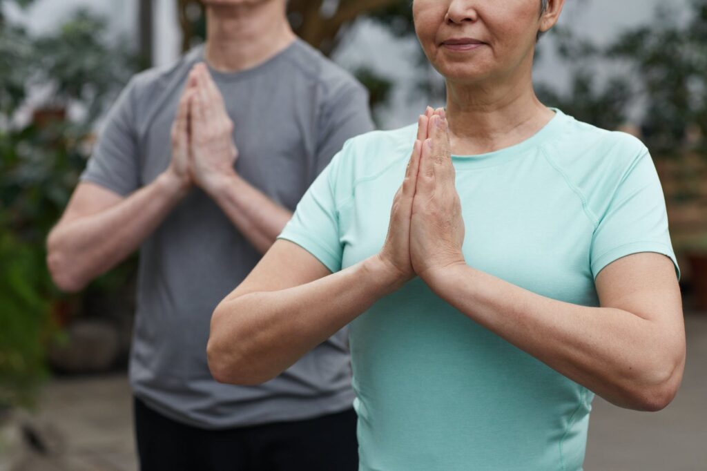 two persons practicing yoga