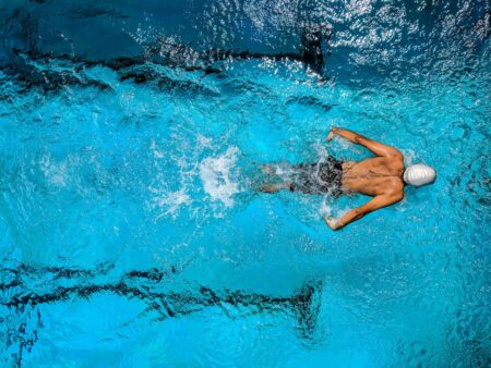 person swimming on body of water